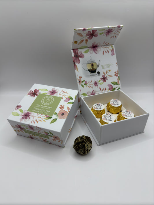 A tea gift box with individually wrapped blooming tea balls.